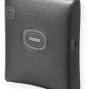 Black portable Instax photo printer with an 'instax' label on the front for printing instant photos from a smartphone.