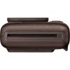 Close-up of a brown compact camera showing a horizontal slot on the side (likely a memory card slot).
