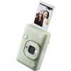 Mint green Instax Mini LiPlay camera with a printed photo ejected from the top, showing a smiling duo in the photo