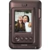Brown Fujifilm compact camera with a photo of two women smiling on its LCD screen