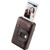 Brown Instax mini LiPlay portable printer with a photo printing from its top slot, showing two friends in the photo