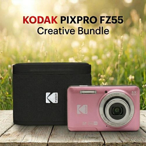 Pink Kodak PixPro FZ55 camera with 5x wide lens next to black camera bag on a wooden table in a sunny outdoor setting, Creative Bundle foreground.