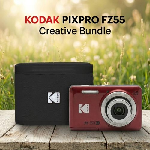 Red Kodak PIXPRO FZ55 camera beside a black carrying case on a sunlit grassy field backdrop, resting on a wooden surface.