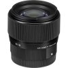 Black camera lens with ribbed focus ring and visible front element, markings read 0.5M/1.64FT and MADE IN JAPAN, used for photography.