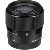 Black camera lens with a knurled focus ring; front element visible, labeled 56mm f/1.4 DC DN.