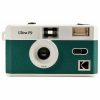 Vintage teal and white 35mm camera with a large central lens and built-in flash on the top right corner