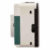 Side view of a vintage white camera with a green textured grip on the left and a protruding lens area at the front/left side of the image.