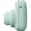 Mint-green instant camera with a compact body and a wide lens on the left, facing sideways.