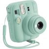 Mint green Instax Mini 13 instant camera with built-in lens and accompanying wrist strap