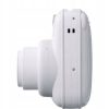 White compact digital camera shown in a side profile with extended lens barrel
