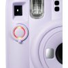 Close-up of a lavender instant camera front panel with a red-ring shutter dial and flash.