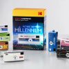 Collection of colorful Kodak Charmera mini digital cameras around a Millennium-themed box on a light background.