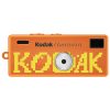 Orange Kodak Charmera toy camera with a large yellow pixelated word and a silver lens in the center.