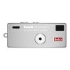 Kodak Charmera keychain digital camera front view with lens in center and brand logo on the right side, silver casing