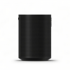 Tall black speaker with a perforated metal grille and a subtle base shadow, viewed from the side.