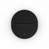Round black media control dial with back, pause, and forward buttons along the bottom edge.