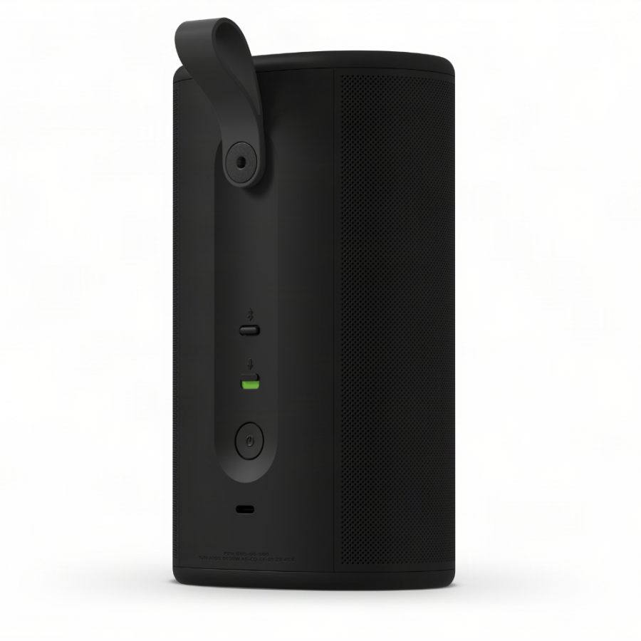 37128_5-900x900 | Kounio.gr Black cylindrical portable speaker with a fold-out handle, perforated grille on the right, and front-side USB-C/port area with a green indicator light and power button
