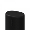 Black Sonos portable speaker with a perforated grille and top touch controls visible (play/pause, volume) on a matte black surface, side logo showing