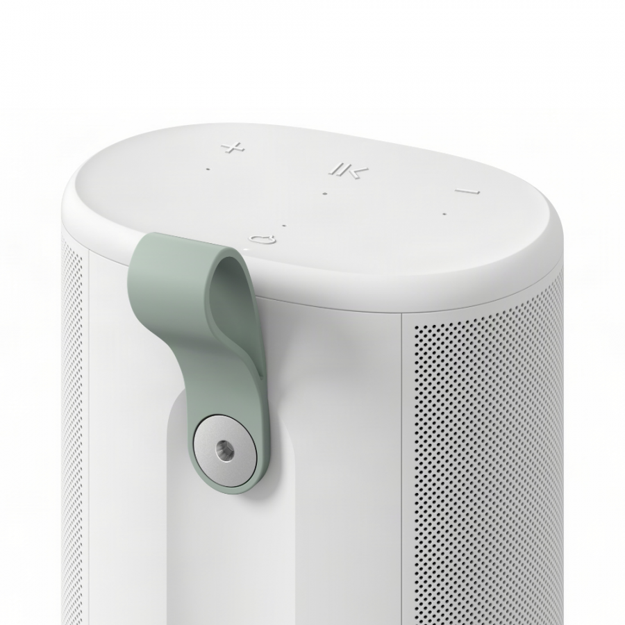 37129_10-900x900 | Kounio.gr White cylindrical portable speaker with a light-green hinged handle on the side and top control buttons (volume, power).