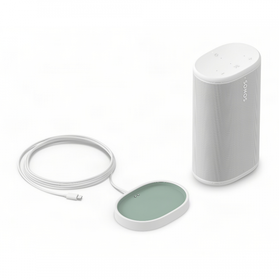 37129_13-900x900 | Kounio.gr White Sonos portable smart speaker with fabric grille and a circular charging dock with green pad nearby, connected by a cable