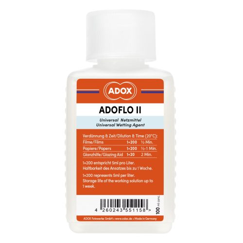 Bottle of ADOX Adoflo II universal wetting agent with an orange label and white cap (product image).