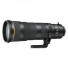 Black telephoto camera lens with tripod collar and large front element against a white background.