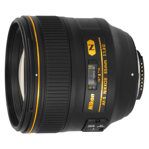 Nikon AF-S NIKKOR 85mm f/1.4G camera lens with yellow trim and focus window, shown at an angle from the front-left side.
