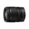 Nikon DX 16-50mm f/2.8 zoom lens shown from the side, black with textured grip