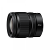 Nikon black camera lens with textured zoom and focus rings, brand name Nikon visible on the side.