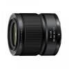 Close-up of a black Nikon DX 35mm f/1.7 lens, showing the knurled focus ring and front element