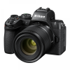 Nikon camera with attached zoom lens, black body, front-left view