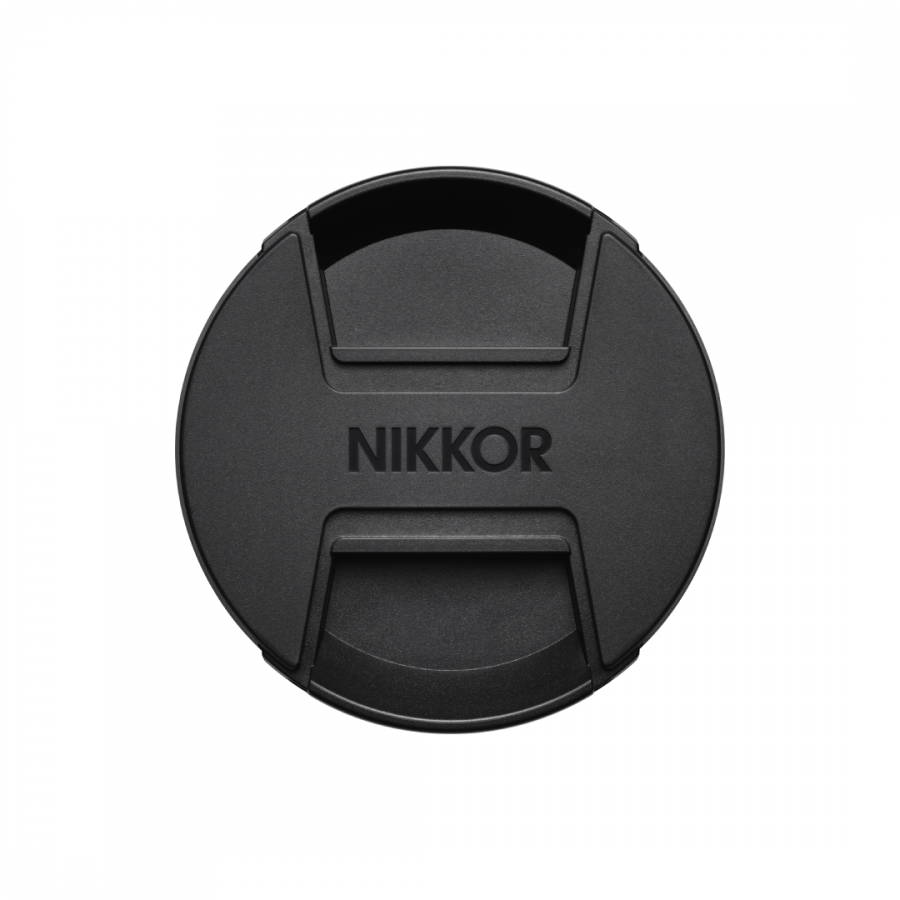 135129_0-900x900-1png | Kounio.gr NIKKOR lens cap: round black plastic with built-in pinch grip and clip tabs.