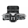 Top-down view of a silver DSLR camera with a black lens attached on a white background.