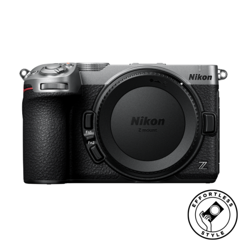 Nikon Z mount mirrorless camera body with textured grip and control dials, front view. Action-ready product photo.