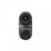 Close-up of a compact camera lens attachment with a prominent front lens and a textured, circular control dial on the body.