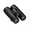 Black Nikon binoculars with textured grip and central focus wheel, close-up image