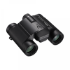 Black compact binoculars with two eyepieces and green-tinted lenses, shown at a slight angle on a white background