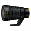 NIKKOR 28-135mm power zoom lens with a yellow ring, shown mounted on a support foot.