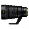 Side view of a black Nikon NIKKOR 28-135mm Power Zoom lens with a tripod foot visible at the bottom and gold ring near the mount.