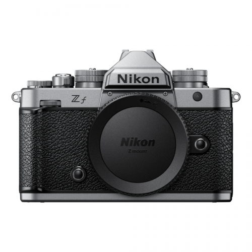 Front view of a Nikon Z mount mirrorless camera body with lens cap on, showing textured grip and control dials on top.