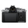 Back view of a silver-and-black digital camera showing a large LCD screen on the left and control buttons on the right edge.