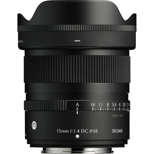 Sigma 15mm f/1.4 DC lens with hood attached, black metal body shown from the side with focus and aperture rings visible.