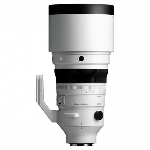 White telephoto camera lens with a large front element and hood, shown from the side with a collar.
