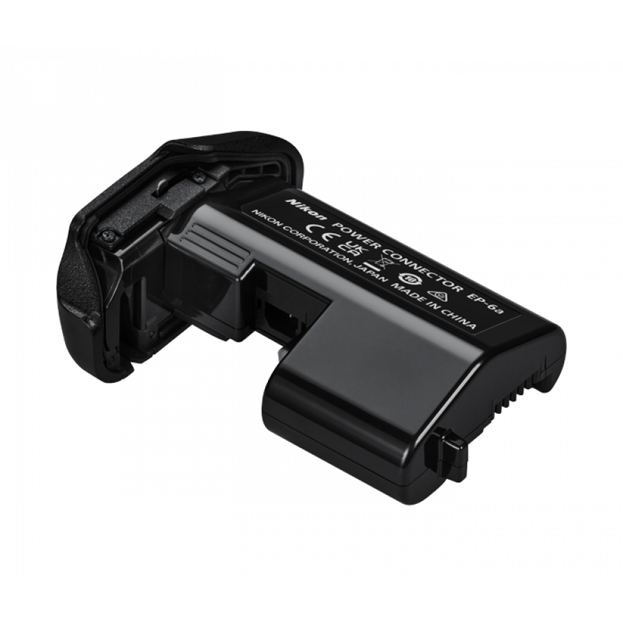27219-EP-6a-power-connector-900x900-1png | Kounio.gr Nikon EP-6 power connector external battery adapter, black plastic with label, shown at an angle