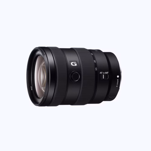 Close-up of a black Sony G-series camera lens with focus and zoom rings, AF/MF switch, and E-mount end against a light background.