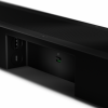 Close-up of a black device's rear panel showing a USB-C port, two circular ports, and a mic input with a green-lit indicator near the slot.