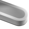White wireless speaker with rounded edges, a perforated front grille, and volume controls along the top edge.