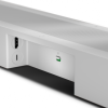 Close-up of a white speaker bar showing a USB-C port, a circular port, and a mic-mute switch with a green indicator light
