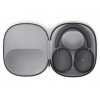 Open gray zip case containing black over-ear headphones with cushioned headband and circular ear cups; brand 'SONOS' visible on right earcup.