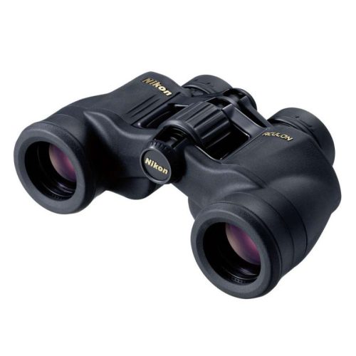 Nikon black binoculars with gold logo viewed from an angle, showing two eyepieces and central focusing wheel, compact field-binoculars for travel.